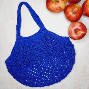 May include: A blue crocheted mesh bag with a wide, open top and a single handle. The bag is made of a fine, delicate yarn and has a loose, airy texture.