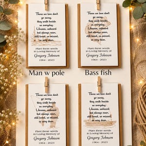 May include: Four rectangular white memorial cards with brown backing, each clipped to a board. Each card features the text 'Choose one on all' at the top, a poem, and the name 'Gregory Johnson 1964-2023'. Illustrations include a man with a pole, a bass fish, a man with a fish, and a boat.