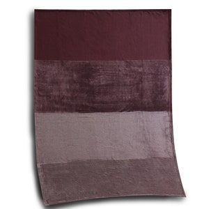 May include: A rectangular throw blanket featuring a color-blocked design with four horizontal bands in varying shades of deep burgundy, dark plum, muted mauve, and a lighter dusty purple, all rendered in a soft, plush, velvet-like fabric texture.