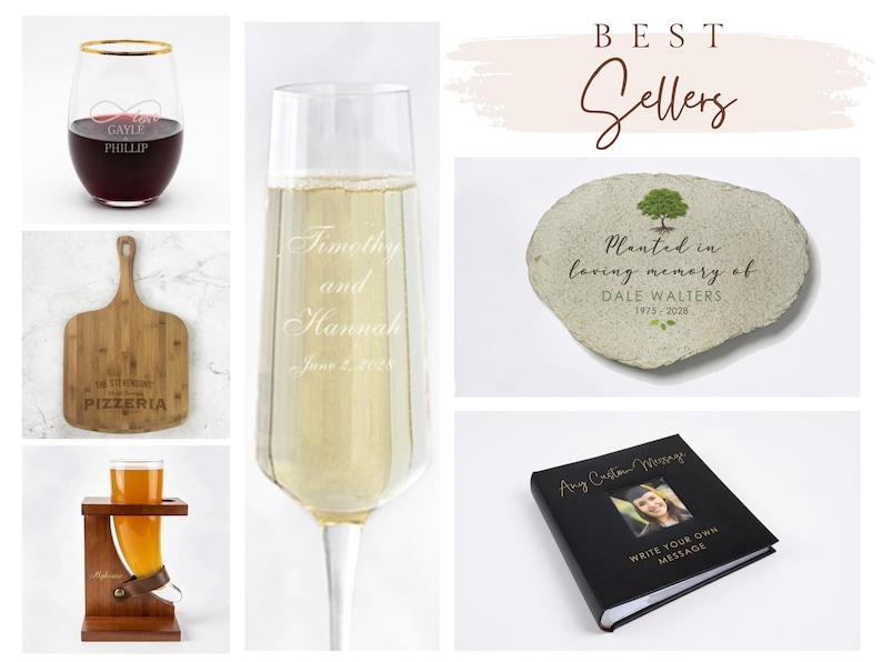 May include: A collection of personalized items including a stemless wine glass with gold rim, a wooden pizza peel, a beer horn with stand, a champagne flute, a memorial stone with tree graphic, and a black photo album with custom text.