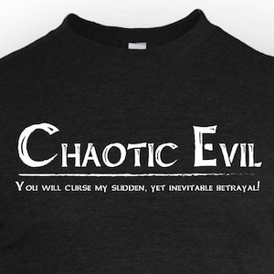 May include: Black t-shirt with white text that reads "Chaotic Evil" above the phrase "You will curse my sudden, yet inevitable betrayal!" The shirt is a crew neck and appears to be made of a soft material.