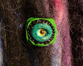 Perle de dreadlock en œil de monstre vert. Taille du trou 6mm