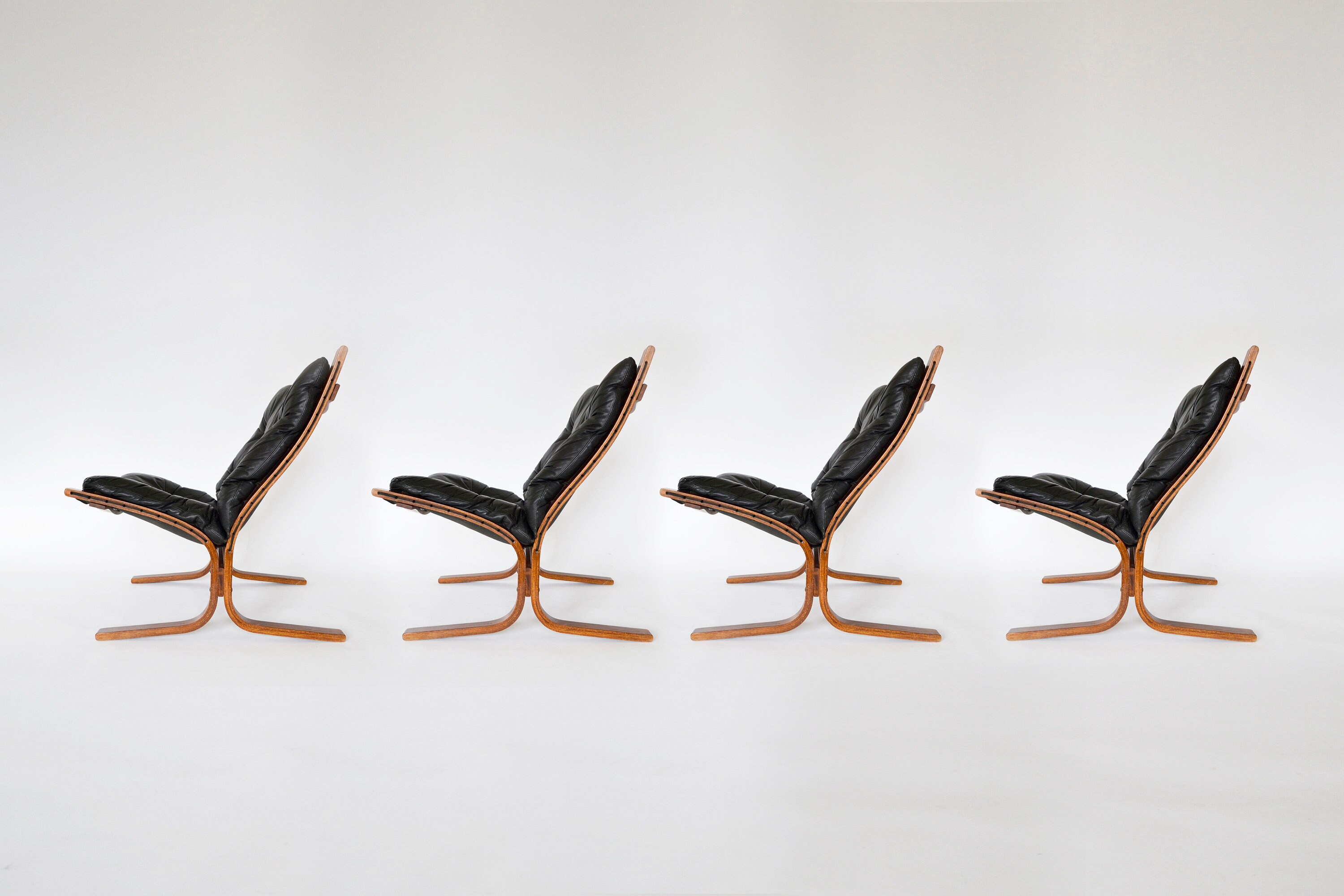 Vintage Black Leather Brown Plywood Siesta Chair Ingmar Relling Westnofa Denmark 1970s set of 4 Scandinavian Mid Century Modern Furniture