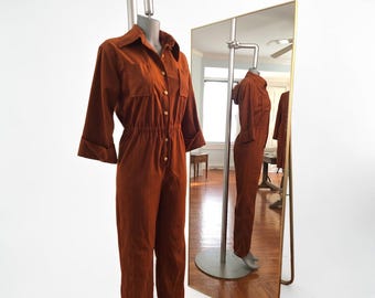 Mono de microgamuza de los años 70, pierna ancha, marrón, cintura alta, pantalones acampanados, capucha desmontable.
