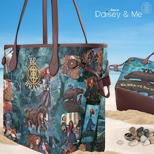 May include: A blue and green tote bag with a collage of images from the movie Brave. The bag features the text "Be Brave" and images of Merida, the bear, and the forest. The bag has brown leather handles and a brown leather strap.