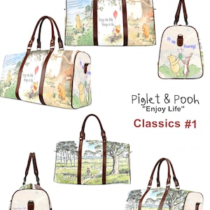 May include: A Winnie the Pooh themed travel bag with brown straps. The bag features illustrations of Winnie the Pooh and Piglet with the text "Enjoy the little things in life".