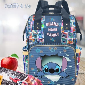 May include: A blue backpack featuring the character Stitch from Lilo & Stitch. The backpack has a large front pocket with Stitch peeking out, and the words "OHANA MEANS FAMILY" are displayed on the front. The bag has adjustable straps and multiple compartments.