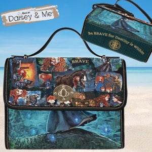 May include: A black leather handbag with a collage of images from the movie Brave. The bag features Merida, the princess, and her bear companion. The bag has a gold metal clasp and a green and black plaid lining. The text "Be Brave for Destiny is Within" is printed on the lining.