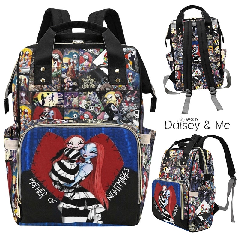 May include: A black and blue patterned diaper bag with a large heart on the front featuring a character from The Nightmare Before Christmas. The bag has a large zippered pocket on the front and two smaller pockets on the sides. The bag has adjustable straps and a handle on the top. The bag is made by Daisy & Me.
