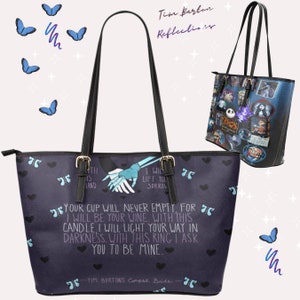 May include: A dark blue tote bag with a black handle and a white design featuring a skeleton couple holding hands. The design includes the text "Your cup will never empty. For I will be your wine. With this candle I will light your way in darkness. With this ring I ask you to be mine." and "Tim Burton's Corpse Bride".