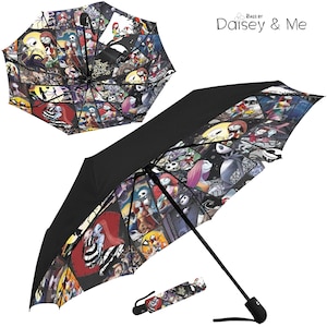 May include: A black and white umbrella with a colorful collage of characters from the Nightmare Before Christmas movie. The umbrella is open and the handle is visible. The umbrella is printed with the words "The Nightmare Before Christmas".