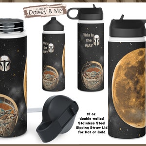 May include: A black and white stainless steel water bottle with a black lid and a straw. The bottle has a graphic of a character from the Star Wars franchise, a moon, and the text "This is the WAY". The bottle is 18 ounces and has a double-walled design.