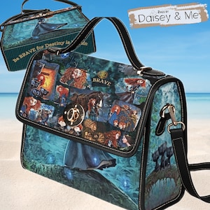 May include: A black satchel handbag with a long adjustable strap. The bag features a collage of images from the movie Brave, including Merida, the bears, and the Scottish Highlands. The bag has a gold-toned clasp and the word "Brave" is printed on the front.