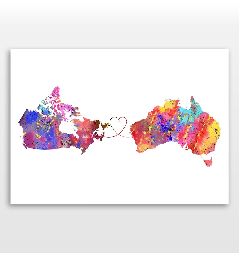 May include: Watercolor print featuring the colorful outlines of Canada and Australia, connected by a heart-shaped line. The countries are filled with vibrant splashes of blue, pink, yellow, and red, set against a white background.