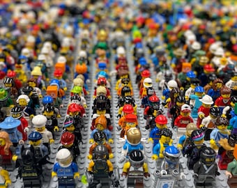 May include: A large collection of colourful Lego minifigures arranged in rows. The minifigures are all different, with a variety of clothing, accessories, and hairstyles.