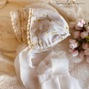 Newborn yellow rosette bonnet