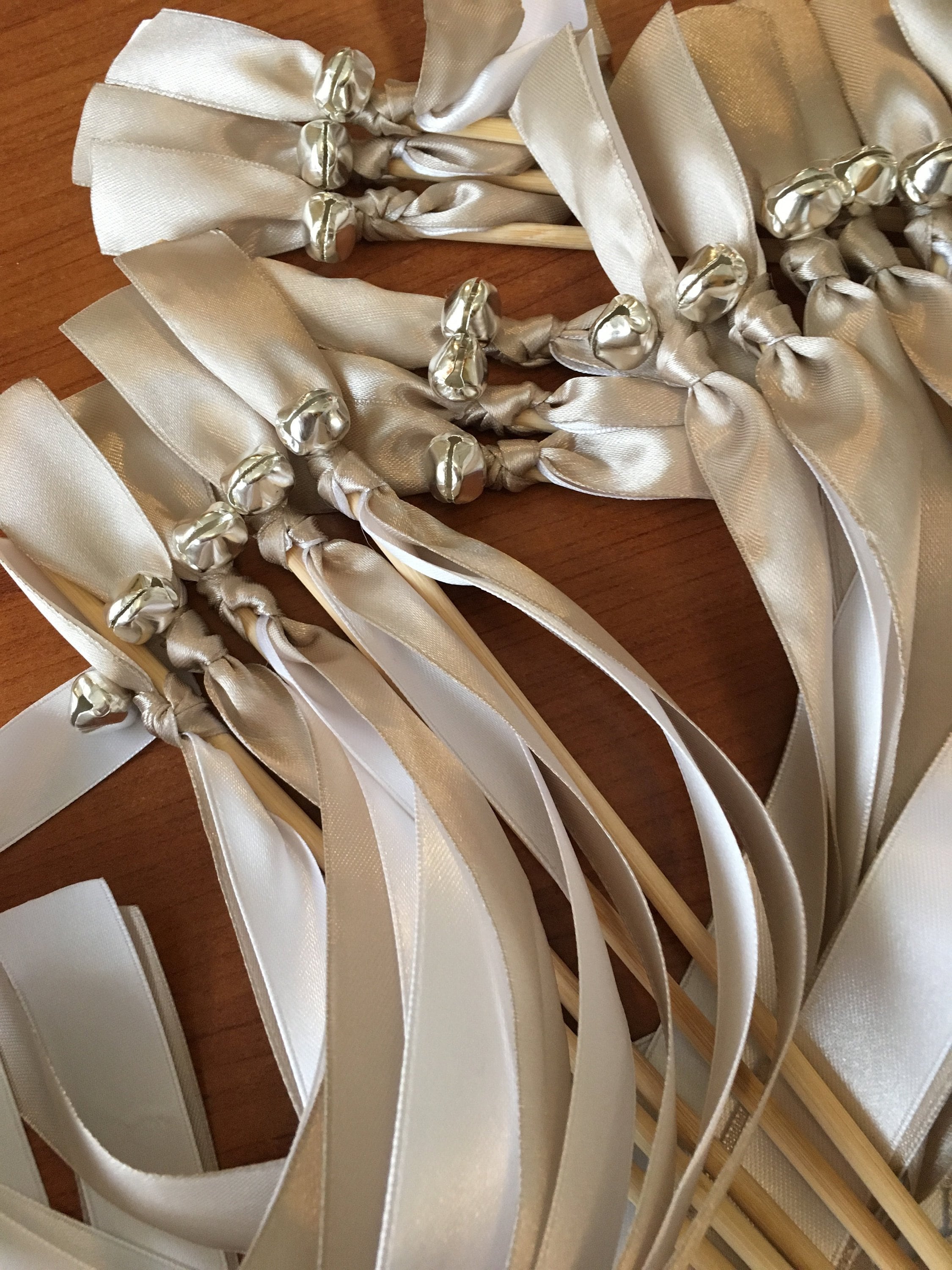 75 White Wedding Wands with silver bells.