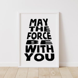 May include: Black and white printable wall art with the text "May the Force be with you" in a stylized font.