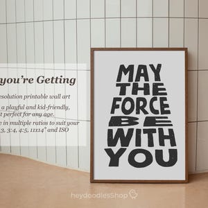 May include: A printable wall art print with a white background and black text that reads "May the Force Be With You".