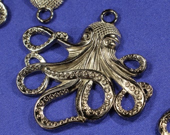 May include: Silver-toned metal octopus charm with detailed tentacles and a textured body. The charm has a loop at the top for attaching to jewelry or other crafts.