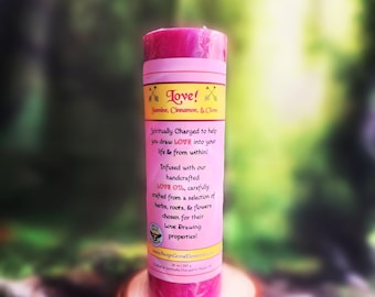 May include: A cylindrical pink candle wrapped in a label with the text Love! Jasmine, Cinnamon, & Clove. The label includes the text Spiritually Charged to help you draw LOVE into your life & from within! and lists 10 oz | 283 g.