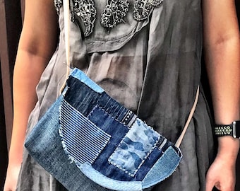 May include: A gray, sleeveless dress with a beaded neckline and a denim patchwork crossbody bag.