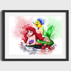 May include: A watercolor illustration of Ariel, the Little Mermaid, with her red hair and green tail. She is swimming with Flounder, a yellow fish with blue fins, and Sebastian, a red crab. The background is a soft pink and green watercolor wash.