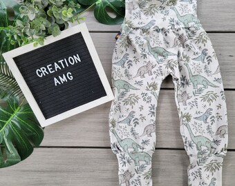 Evolutionary pants with dino and foliage pattern