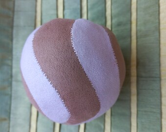 Suede hand size soft ball.