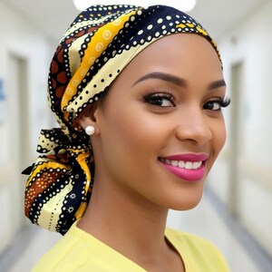 May include: A patterned head covering in yellow, black, and brown. The head covering is tied at the back and worn by a person wearing a yellow top. The head covering has a repeating pattern of dots and stripes.