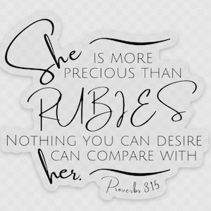 May include: Black and white typography print with the quote "She is more precious than rubies. Nothing you can desire can compare with her. Proverbs 3:15"