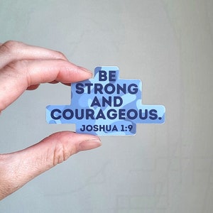 May include: A blue and white camouflage sticker with the text "BE STRONG AND COURAGEOUS. JOSHUA 1:9"