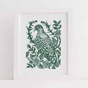 May include: A green and white print of a bird perched on a branch with flowers. The bird is detailed with feathers and the flowers are stylised.