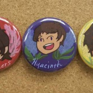 May include: Five round buttons with colourful backgrounds and cartoon characters. The buttons feature the names Gladiolus, Heathens, Hyacinth, Jolphin, and Bouvardia.