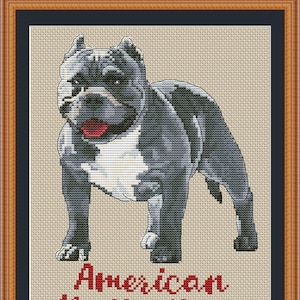 May include: Cross stitch pattern of an American Bully dog, with the text "American Bully Mom" and the website "PuntAGOpettiePatternetsy.com" below the dog.