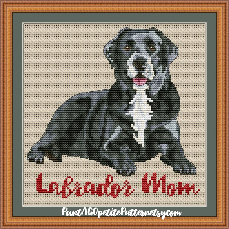 May include: Cross stitch pattern of a black and white dog with the text "Labrador's Mom" in red.