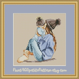 Mother and baby in  knitted hats cross stitch pdf pattern