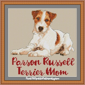 Può includere: Schema di punto croce con un Jack Russell Terrier bianco e marrone sdraiato. Lo schema è intitolato "Parson Russell Terrier" e include il sito web "PuntAGOppetitePatternetsy.com".