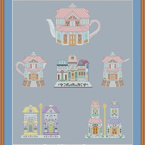 May include: A cross-stitch pattern featuring whimsical buildings, including a teapot-shaped tea room and other structures labeled "Creamery," "Confectionary," "Cheese," "Garlic," "Oil," and "Vinegar." The buildings are in pastel colors with detailed architectural designs.