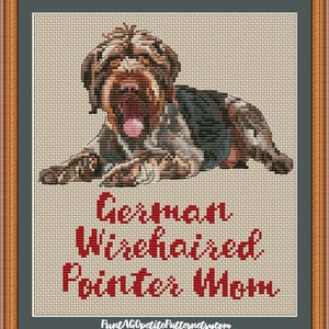 May include: Cross-stitch pattern of a brown and white German Wirehaired Pointer dog lying down. The pattern includes the text "German Wirehaired Pointer" in red.