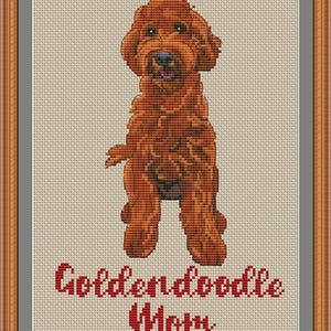 May include: Cross stitch pattern of a red golden doodle dog with the text "Golden doodle Mom" below.