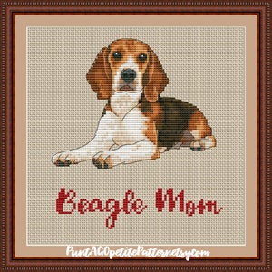 May include: Cross stitch pattern of a beagle dog lying down with the text "Beagle Mom" below it.