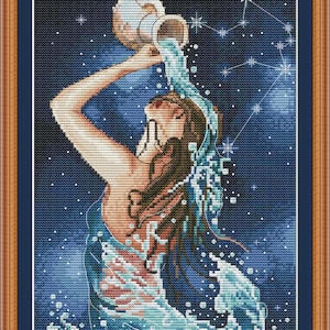 May include: A cross-stitch pattern featuring a woman pouring water from a pitcher, surrounded by stars. The pattern is on a blue background with white stars and a constellation in the upper right corner. The text "PuntAGOpetitePatternetsy.com" is at the bottom of the pattern.