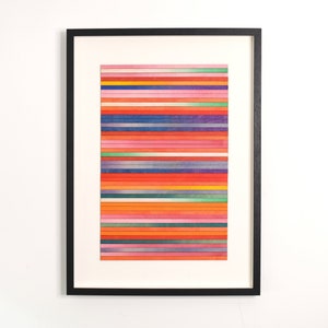 May include: A framed abstract art print with a colorful horizontal stripe pattern in shades of red, orange, yellow, green, blue, and purple.