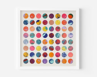 May include: A framed artwork featuring a grid of 64 colorful circles, each with a unique abstract pattern. The circles are arranged in a square grid, with a white background.