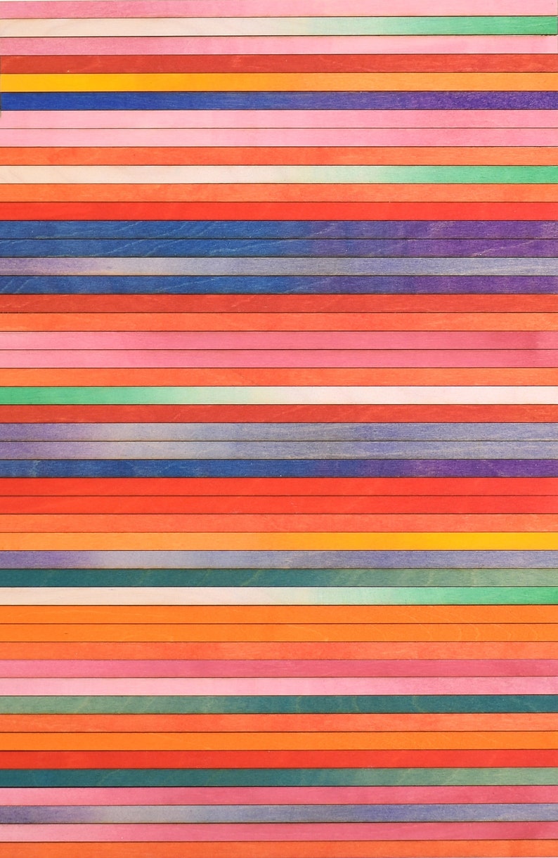 May include: A colorful wooden wall art piece with horizontal stripes in various shades of red, orange, yellow, green, blue, and purple.