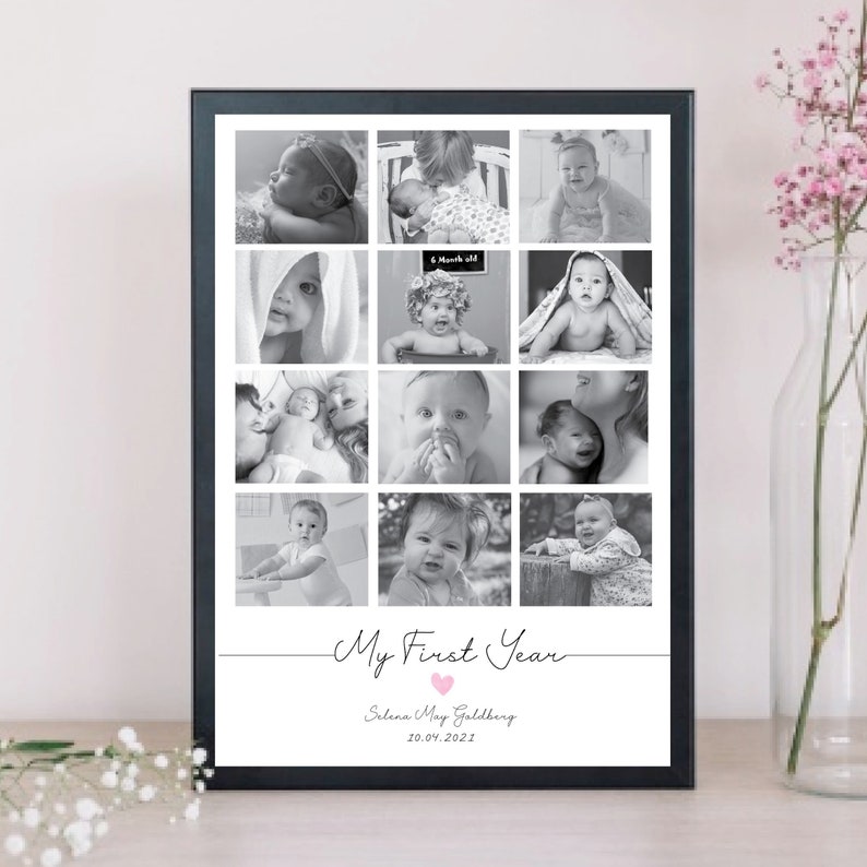 May include: A black framed photo collage with twelve black and white baby pictures. The words "My First Year" are written in cursive, with a pink heart. The baby's name and date are below the text.