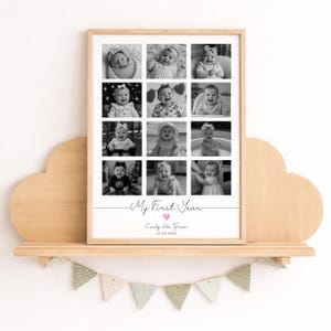 May include: A rectangular wooden frame containing a collage of twelve black and white baby photographs. Below the photos, the text reads My First Year, followed by the name Emily Isla Green and the date 25.02.2025 with a small pink heart.