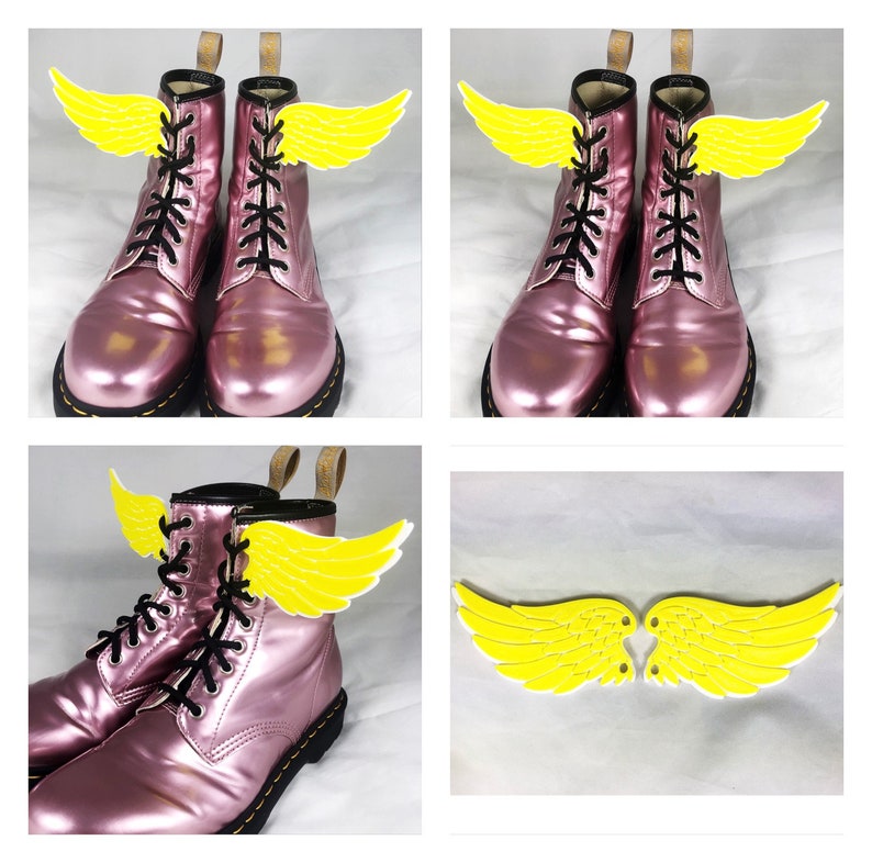 May include: Pink leather boots with yellow wings attached to the laces. The wings are made of felt and have a simple design.