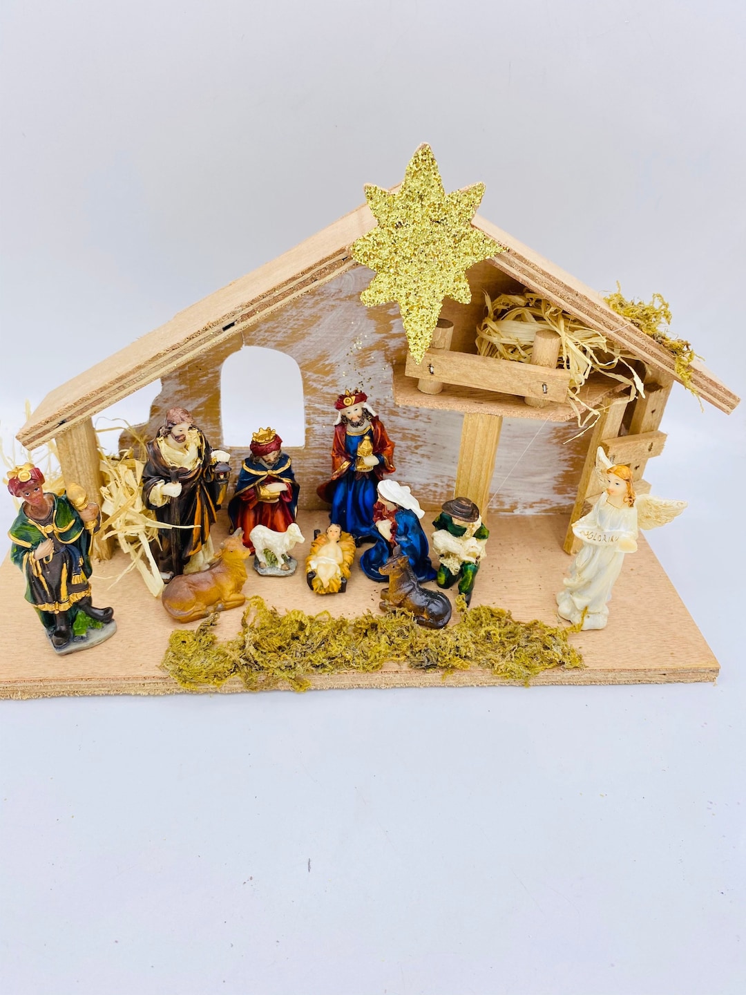 Resin Christmas Nativity Scene: 12-Piece Set with Wood Manger